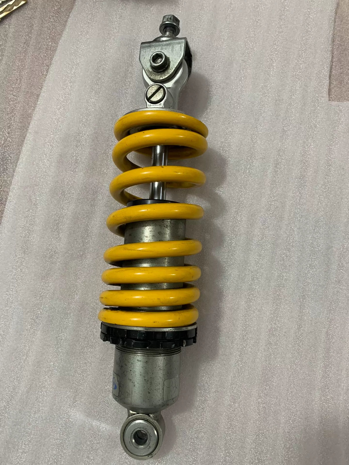 Ducati Monster 796 rear shock absorber laid flat, full length view showing used condition