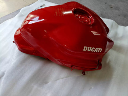Red fuel tank for Ducati SuperSport 939, front three-quarter view showing smooth bodywork and filler cap