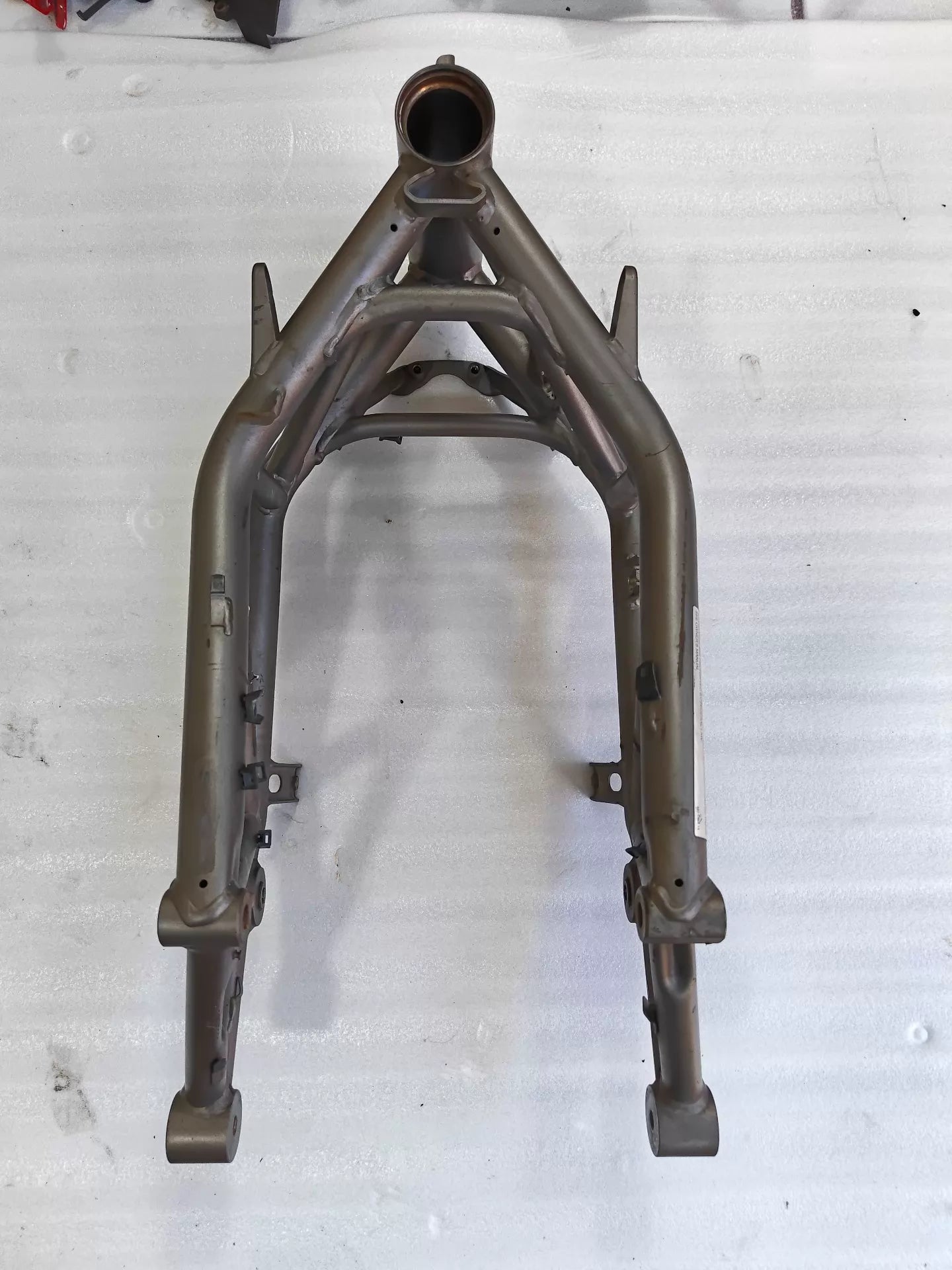 Grey trellis frame front view for Ducati MTS1200, steering head tube up, engine mounts, used bare metal