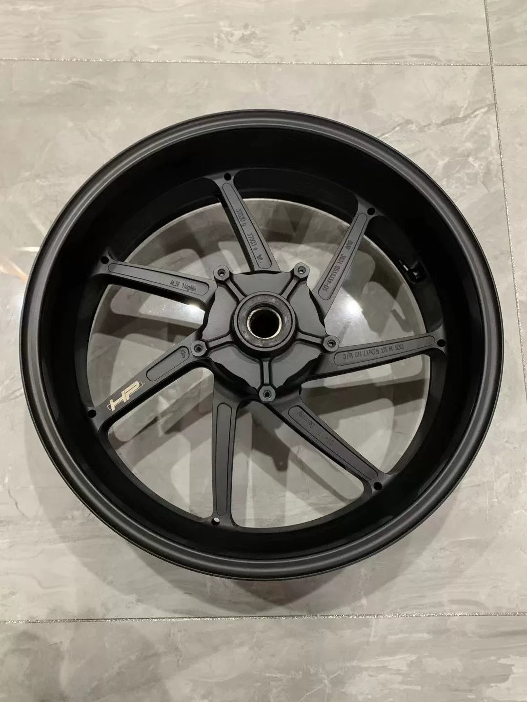 BMW S1000RR forged front wheel M HP Package, three-quarter angle highlighting rim finish and spokes