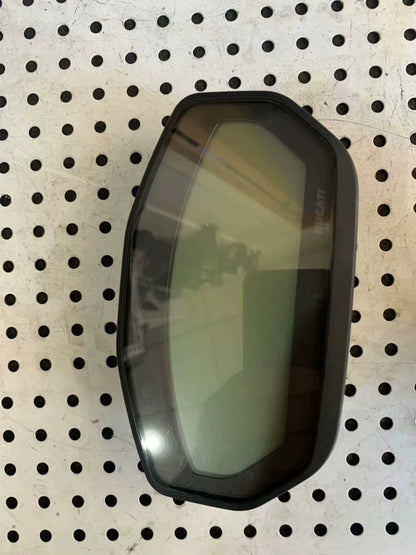 Ducati Monster 797 instrument cluster front view, LCD screen off, DUCATI logo, on pegboard