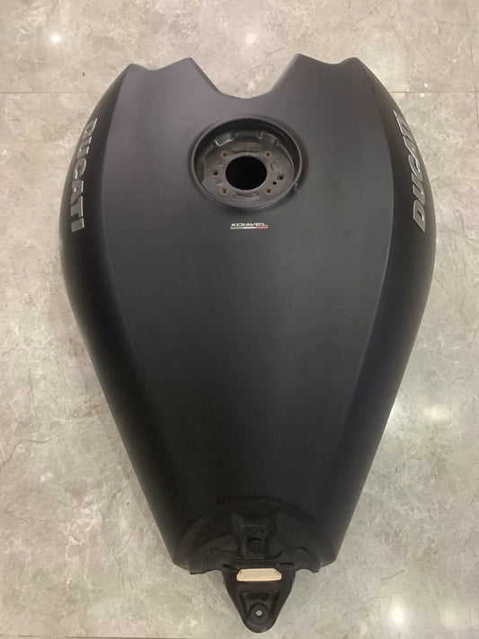 Matte black fuel tank for Ducati XDiavel S, front three-quarter view showing smooth finish and mounting points
