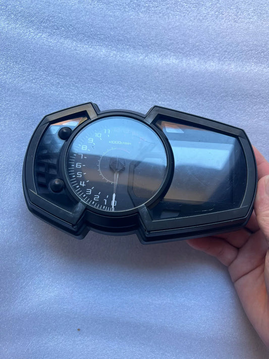 Kawasaki Ninja 400 instrument cluster front view showing digital display and speedometer face