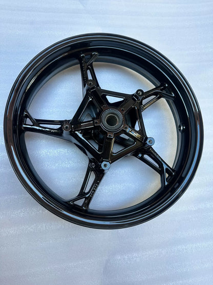 BMW S1000RR front wheel, full face view showing spoke design and hub center, clean used condition