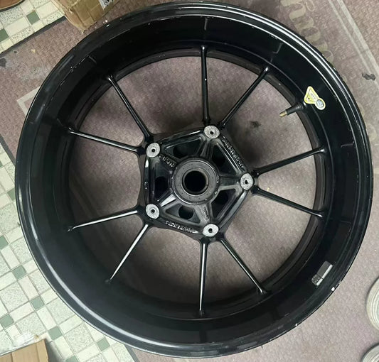 Rear rim for BMW S1000RR shown at front angle, silver spokes, clean condition