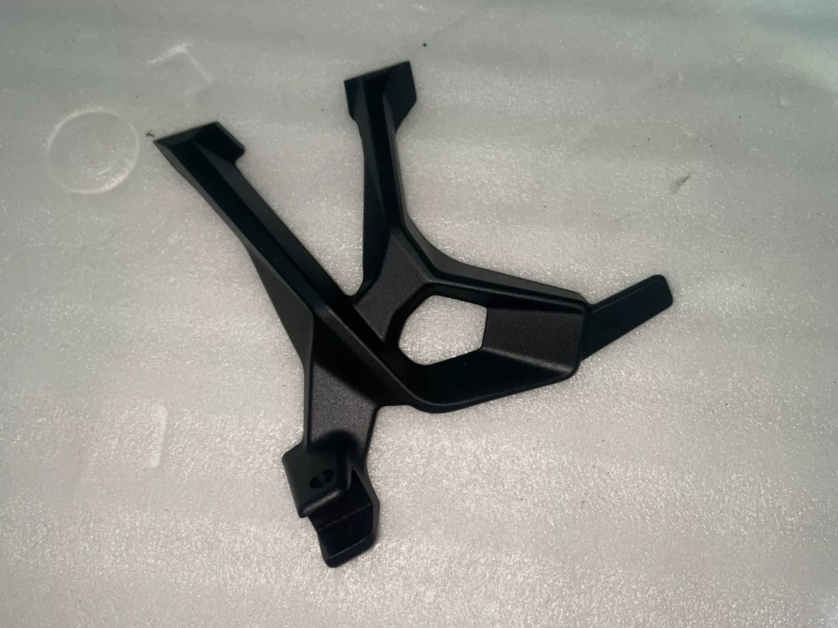 BMW S1000XR footpeg bracket, front angled view showing mounting holes and machined aluminum construction