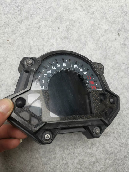 Kawasaki Z900 instrument cluster front view showing digital display and analog tachometer in good condition
