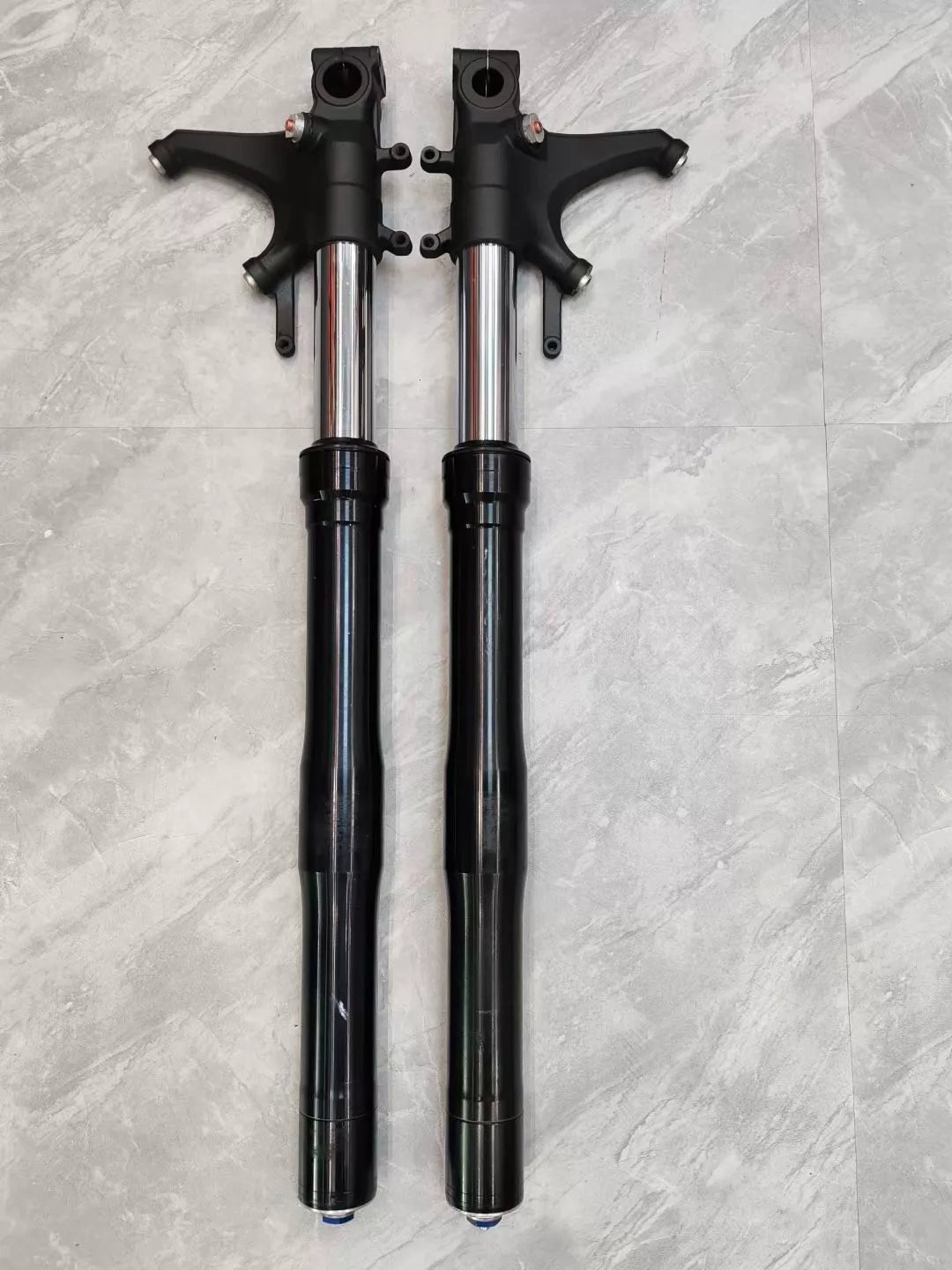 Honda CBR 600RR right fork leg shown upright, full length view, silver tube and black lower leg visible