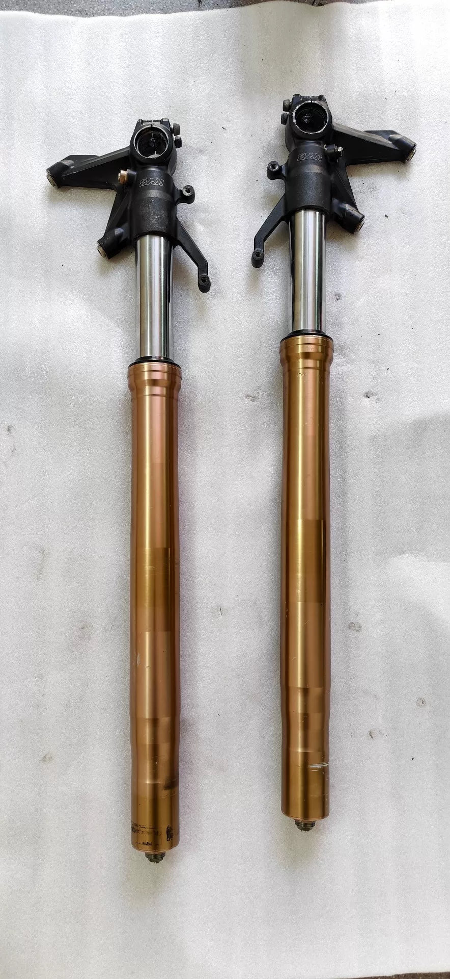 Kawasaki ZX-10R front fork pair, full length front view showing chrome stanchions and black lower legs