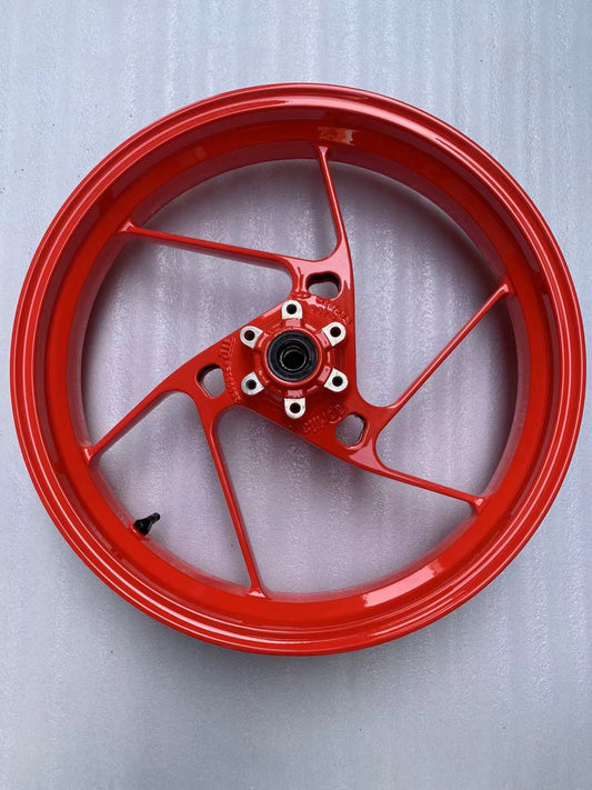 Red front rim for Aprilia RS660, full face view, five-spoke design with center hub bearing, glossy condition