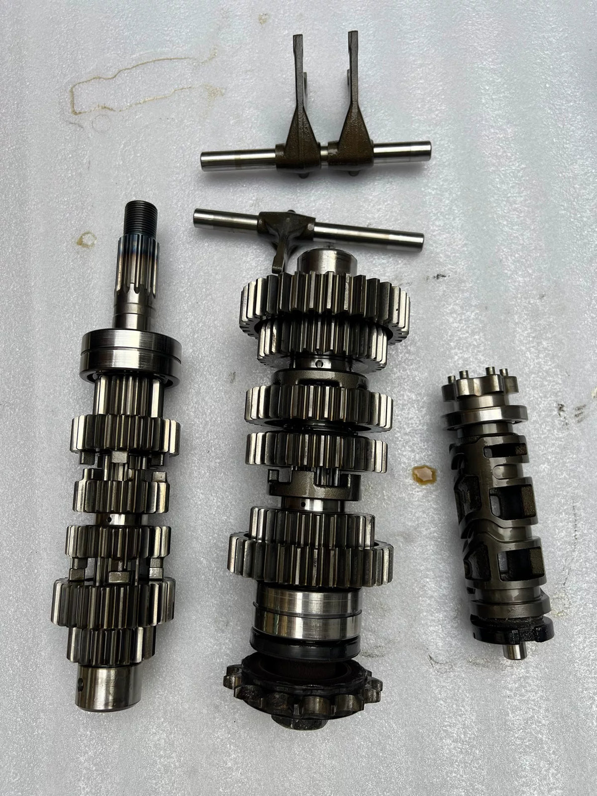 Kawasaki Z900RS transmission unit, front angle view showing gear shafts and casing in good used condition