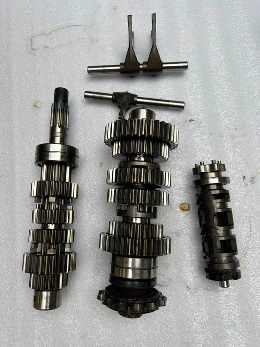 Kawasaki Z900RS transmission unit, front angle view showing gear shafts and casing in good used condition