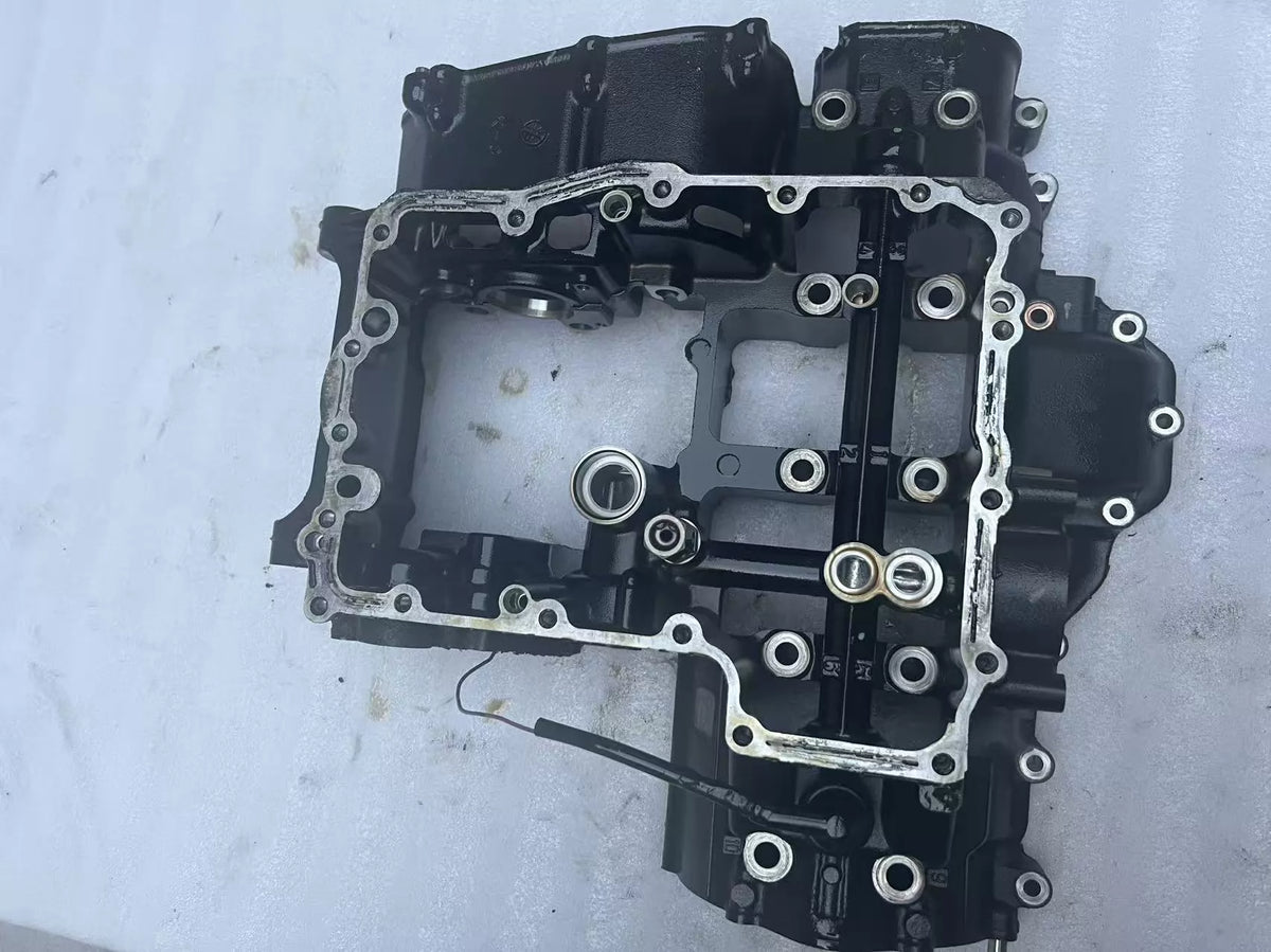 Lower crankcase for Kawasaki Z900, front three-quarter view showing casting detail and bolt holes, used condition