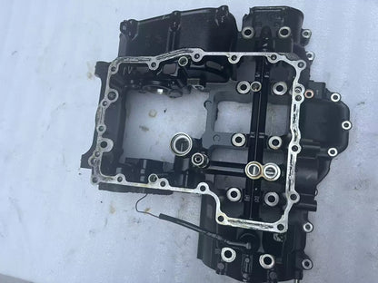 Lower crankcase for Kawasaki Z900, front three-quarter view showing casting detail and bolt holes, used condition