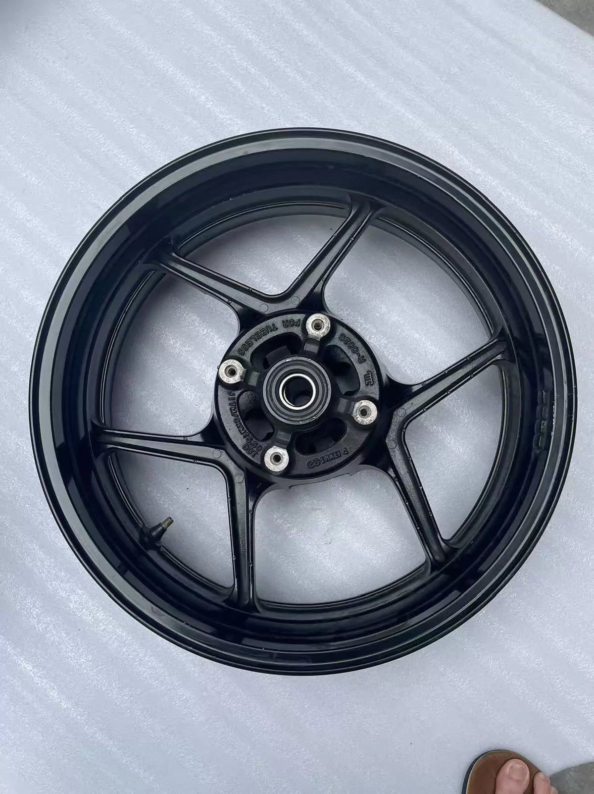 Kawasaki ZX-6R rear wheel rim WHEEL-ASSY gloss black, full assembly view showing complete wheel structure