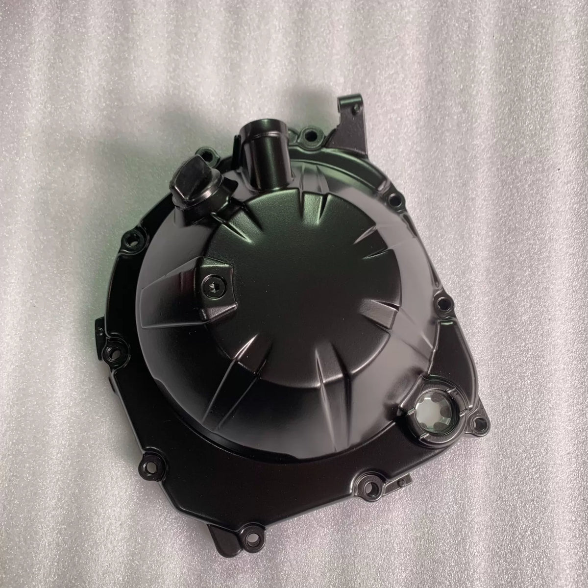 Black clutch cover for Kawasaki ZR900 Z900, front view showing oil sight glass, ribbed finish, good condition