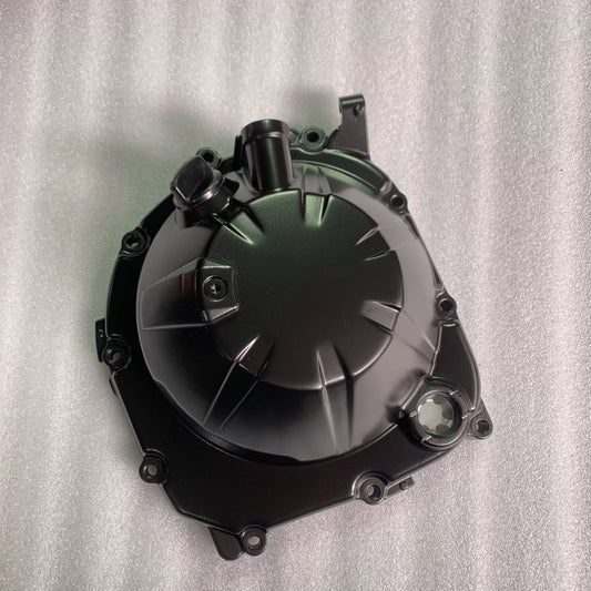Black clutch cover for Kawasaki ZR900 Z900, front view showing oil sight glass, ribbed finish, good condition