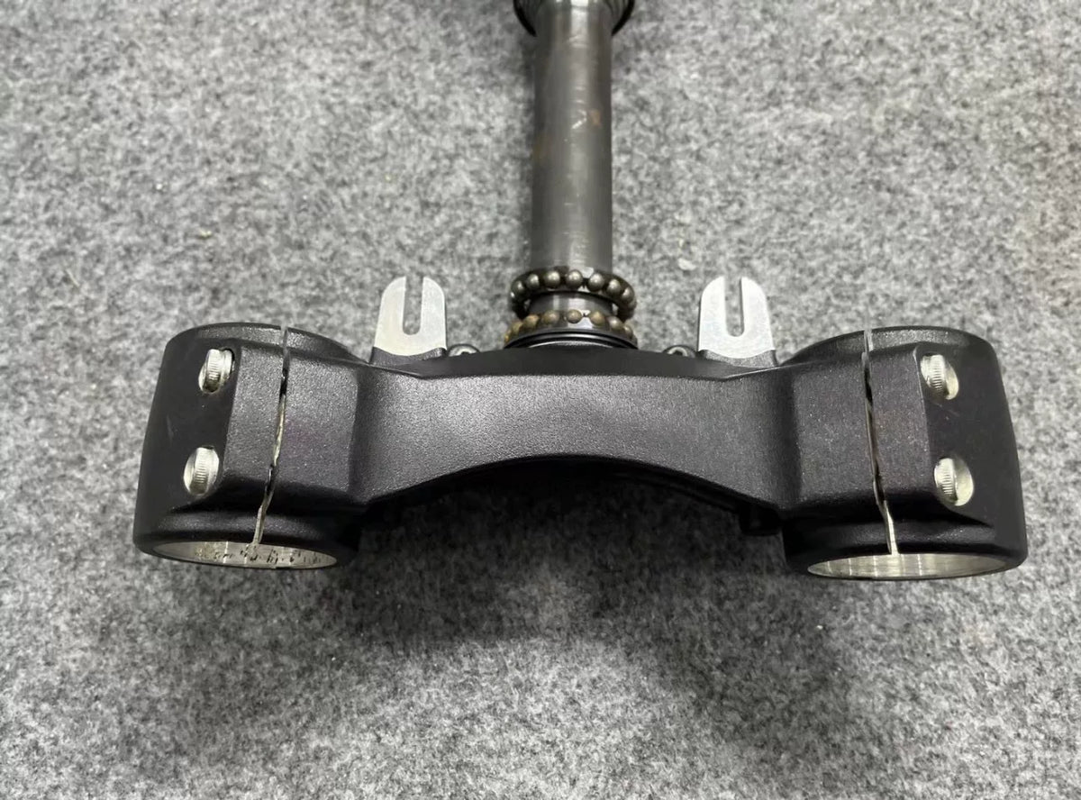 Ducati Monster 821 triple tree clamp set with handlebar bracket, angled view showing stem and clamp detail