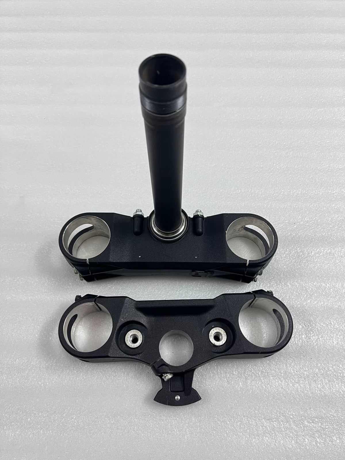 Lower fork yoke Ducati Multistrada 1200, front-facing view of steering stem mount and clamp bores