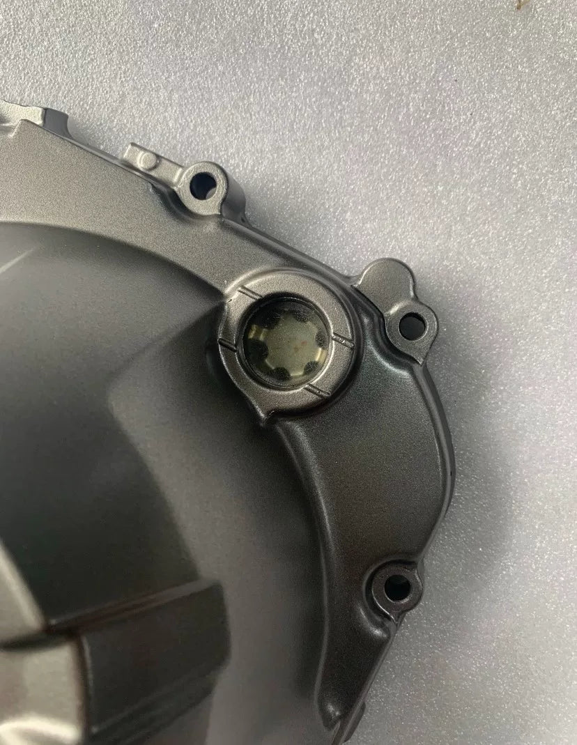 Kawasaki Z800 engine clutch cover side angle view, casting details visible, refurbished OEM 2013-2015