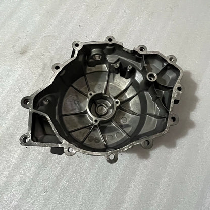 BMW F900R stator cover side profile view, smooth casting detail, mounting points visible
