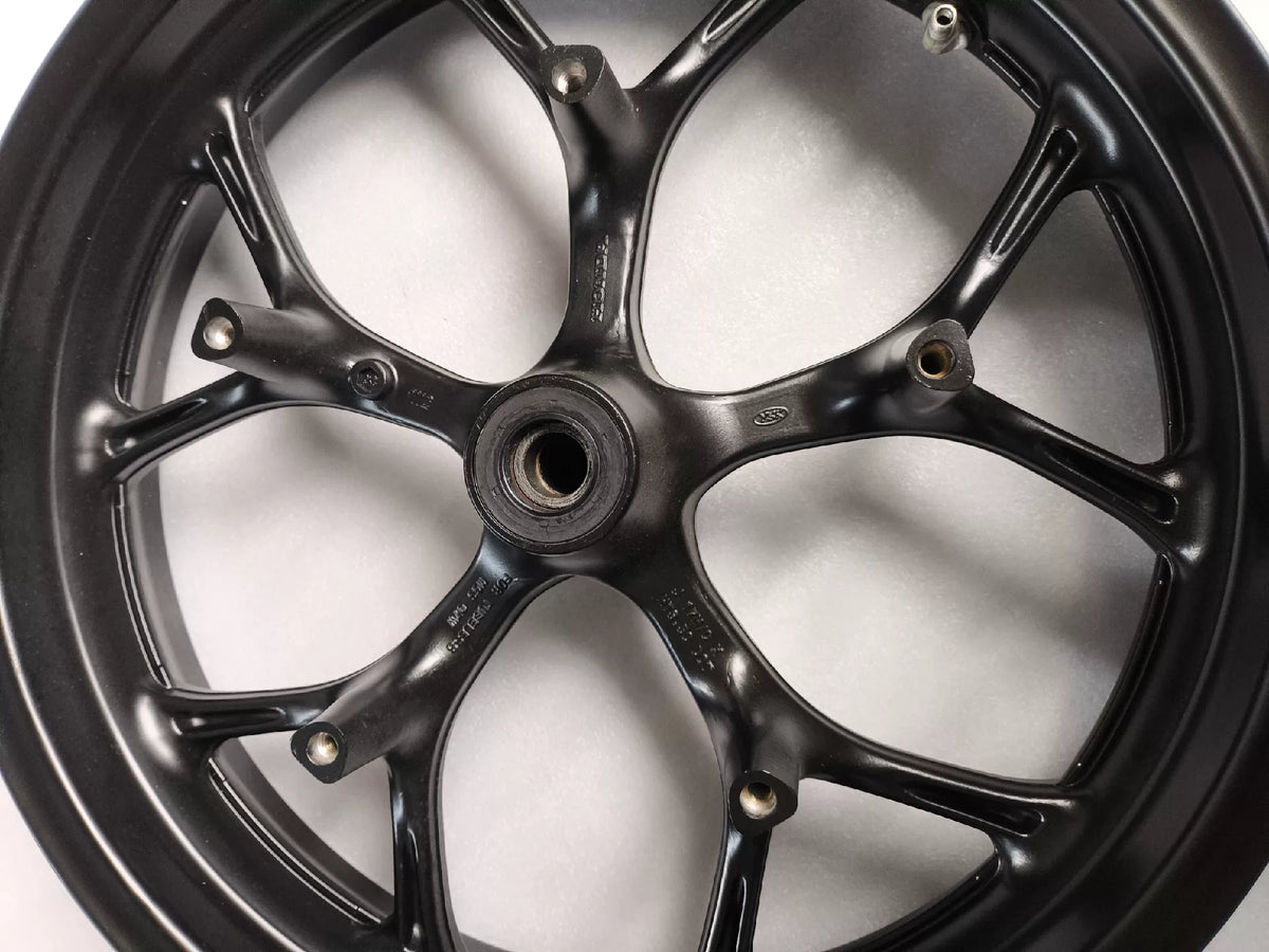 Black front wheel Honda NC750X side profile view showing spoke pattern and hub detail