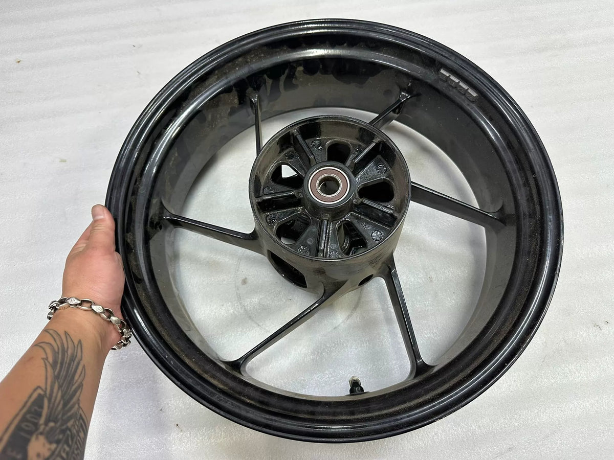 OEM Aprilia RS660 rear wheel 5.5x17 side profile angle displaying rim width and finish