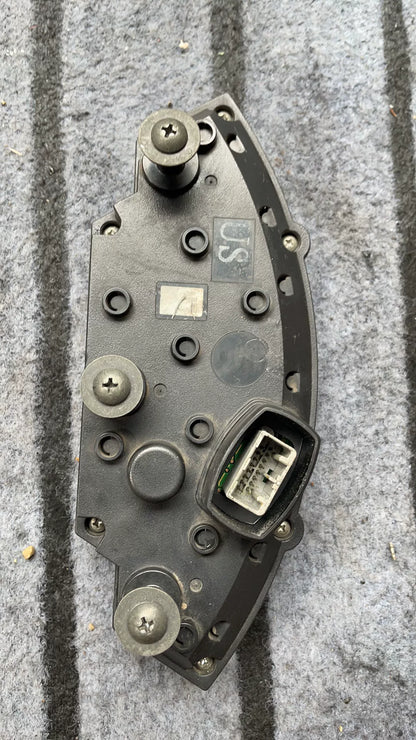 Kawasaki ZX-10R instrument cluster angled view displaying LCD display and warning indicators clearly