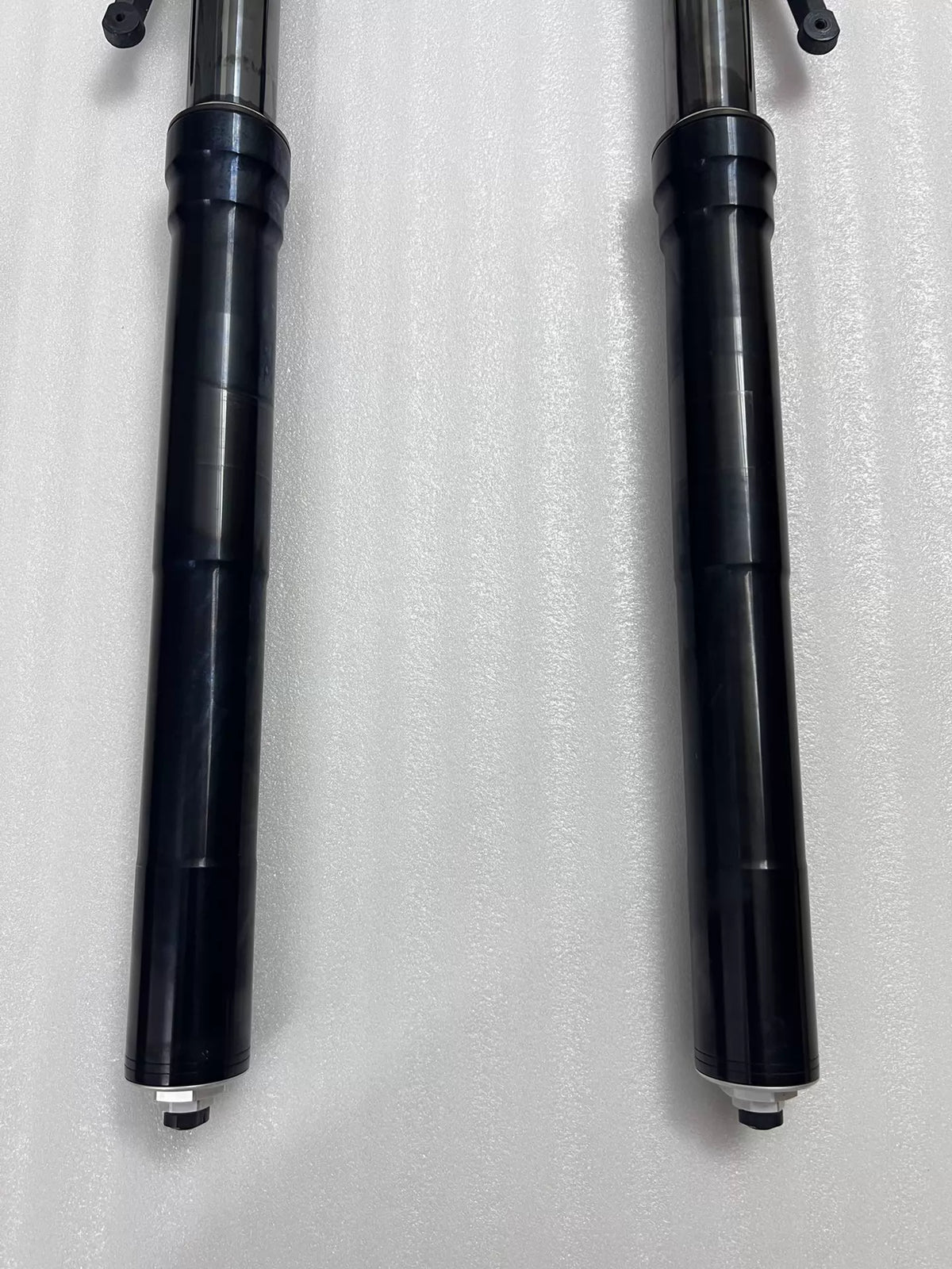 Ducati Diavel 1200 front fork upper tube close-up, chrome stanchion surface detail, minor wear visible