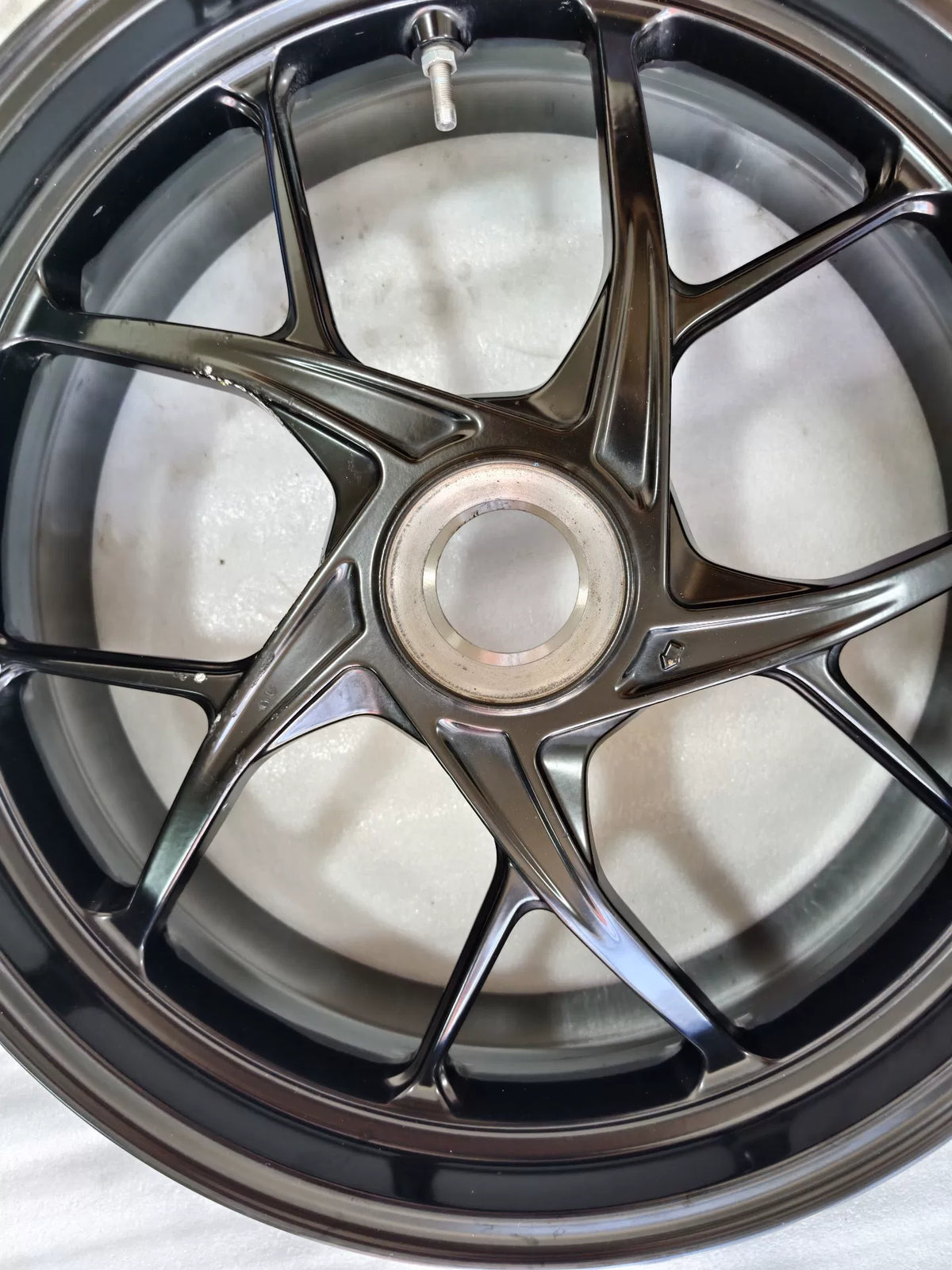 Ducati Panigale V2 rear wheel, side profile angle displaying rim and brake disc mount, used