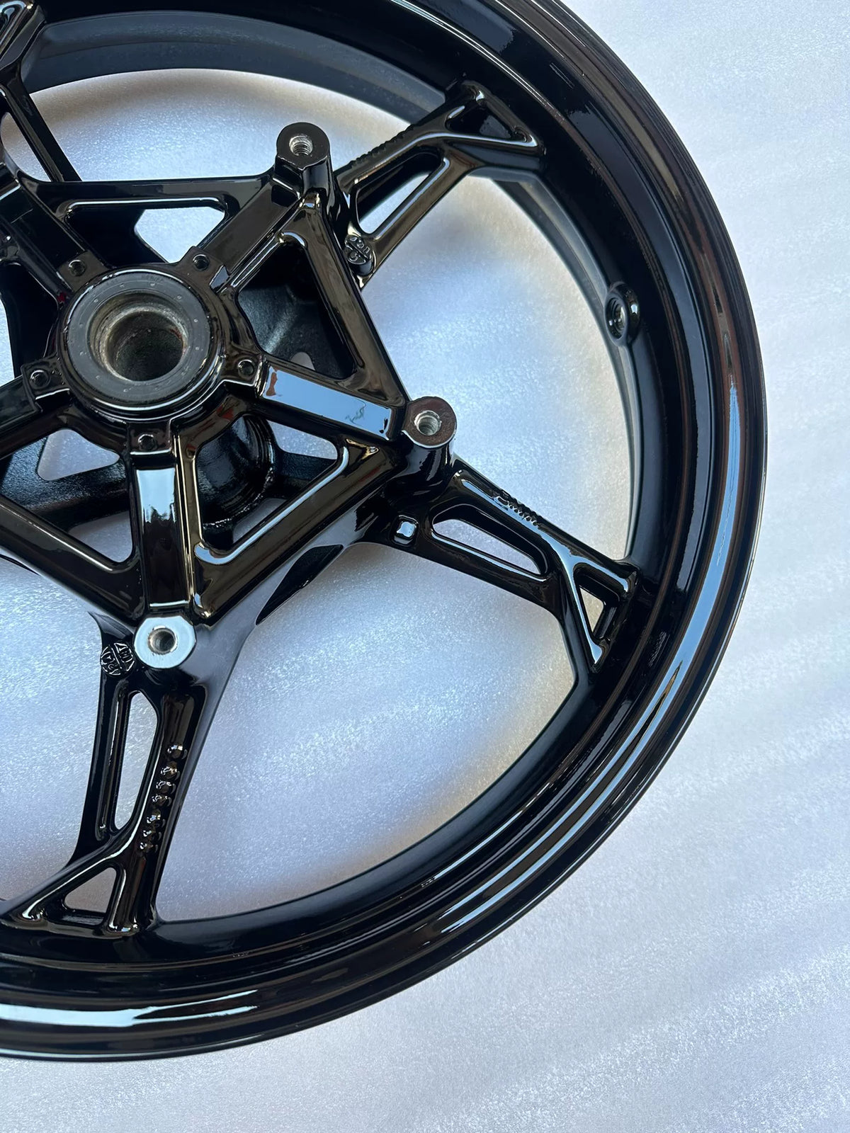 BMW S1000RR front wheel side profile view displaying rim width and brake disc mounting flange