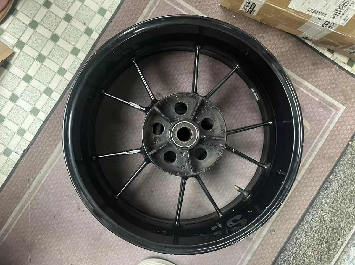 Rear rim for BMW S1000RR overhead view, centered hub, silver alloy construction