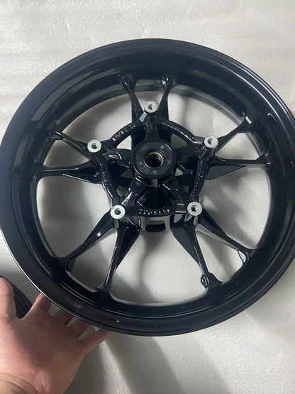 BMW C400X front wheel rim, angled side profile view highlighting rim depth and valve stem hole