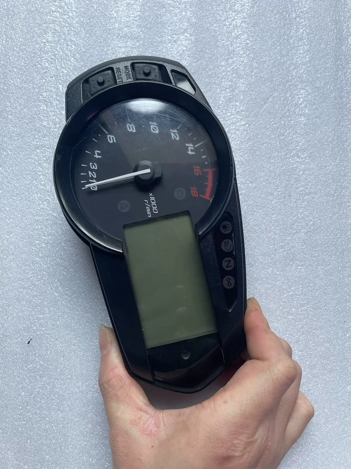 Kawasaki ZX-6R 2009-2024 instrument cluster angled view displaying speedometer and warning indicators