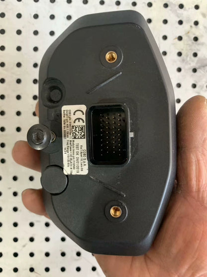 Rear of Ducati Monster 797 instrument panel, COBO label, multi-pin connector, gold mounts, held in hand