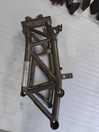 Side view of grey trellis frame for Ducati MTS1200 with noise emission label, engine mount bores, used