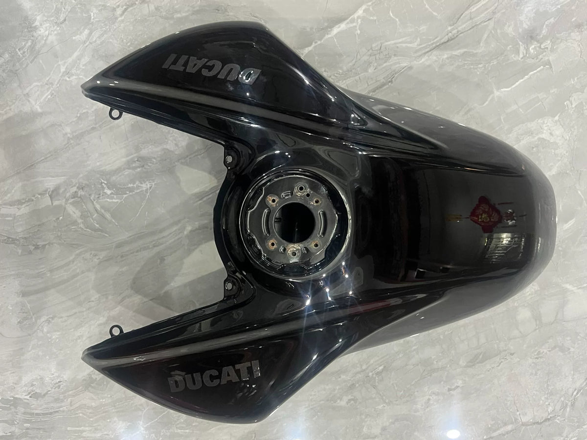 Ducati Diavel V4 black gas tank rear view showing tank underside and connection fittings detail