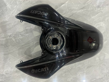 Ducati Diavel V4 black gas tank rear view showing tank underside and connection fittings detail