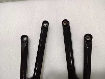 BMW S1000RR footpeg bracket, side profile view displaying full bracket shape and bolt hole positions