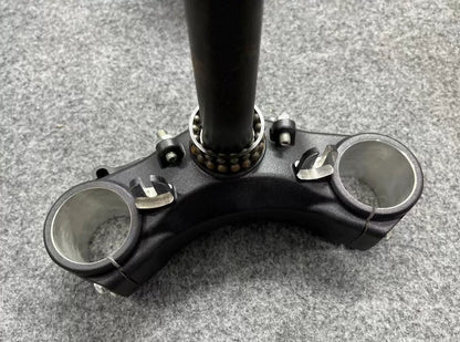 Ducati Monster 821 handlebar bracket mount detail, showing clamp holes and machined aluminum finish