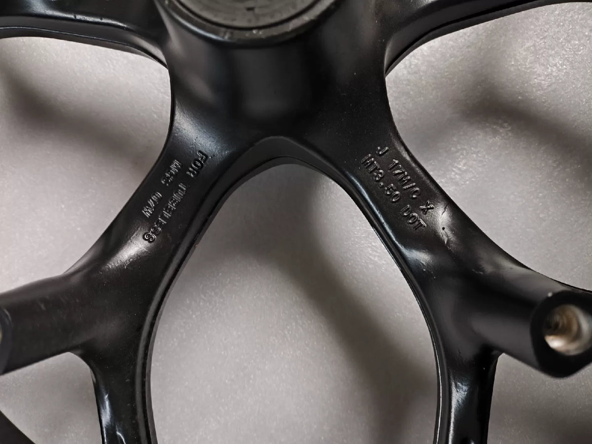 Black front wheel Honda NC750X detail shot of rim edge and tire bead seat surface