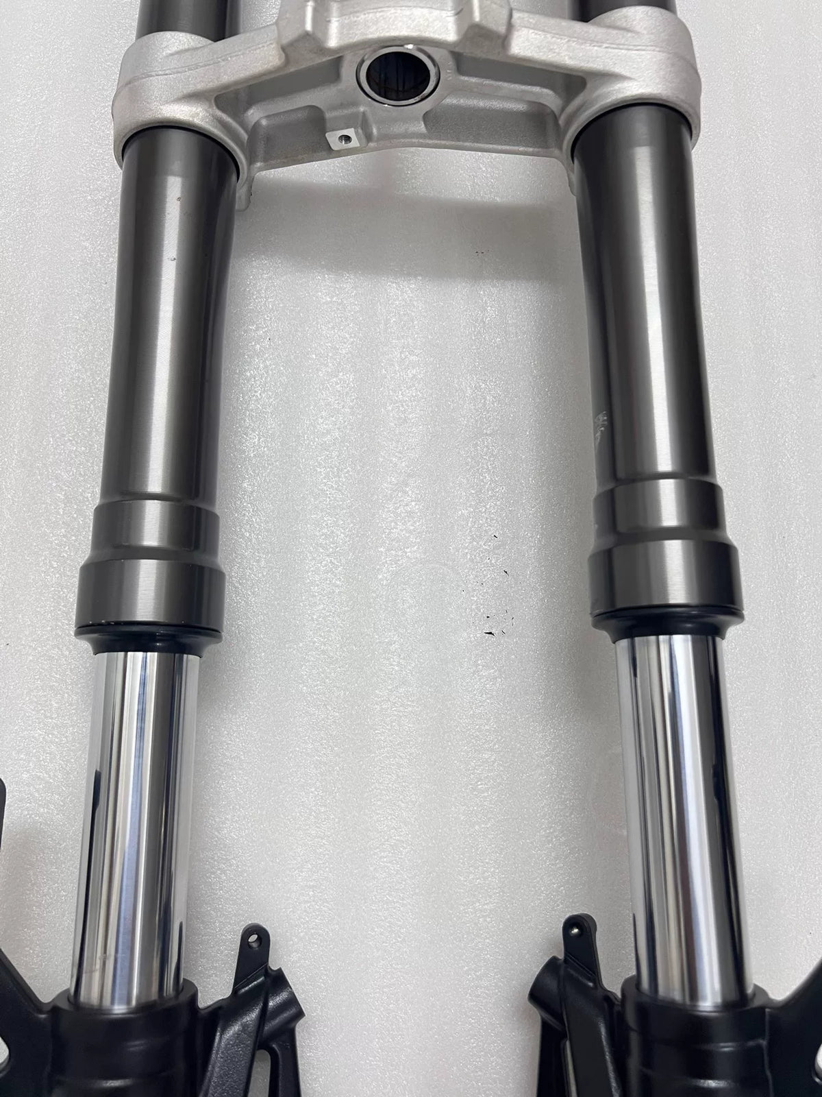 Complete front fork with triple clamps removed from bike, Ninja 1000SX, angled side view