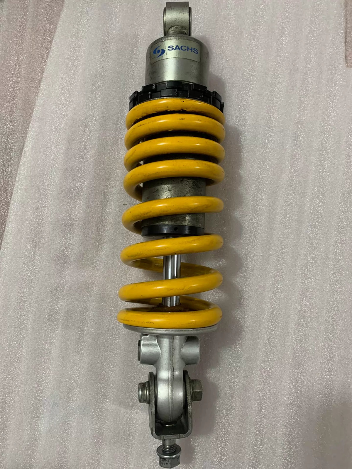 Ducati Monster 796 rear shock lower mount and linkage end, close-up showing hardware