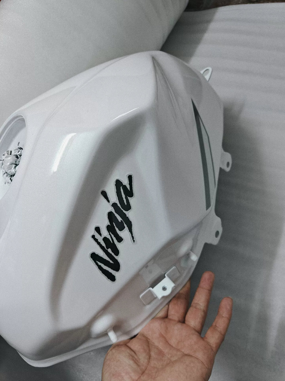 Kawasaki Ninja 400 white fuel tank close-up detail of filler neck and top surface condition