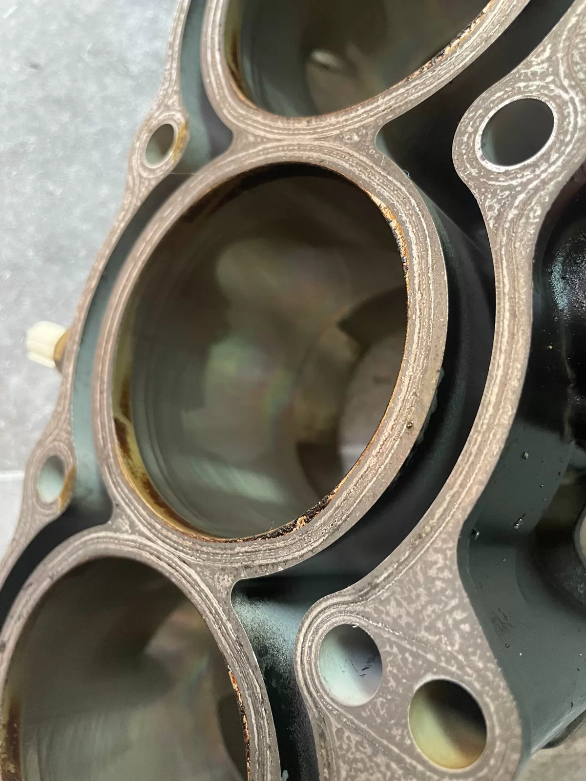 Kawasaki Z900 cylinder block top-down view showing four open cylinder bores and deck surface