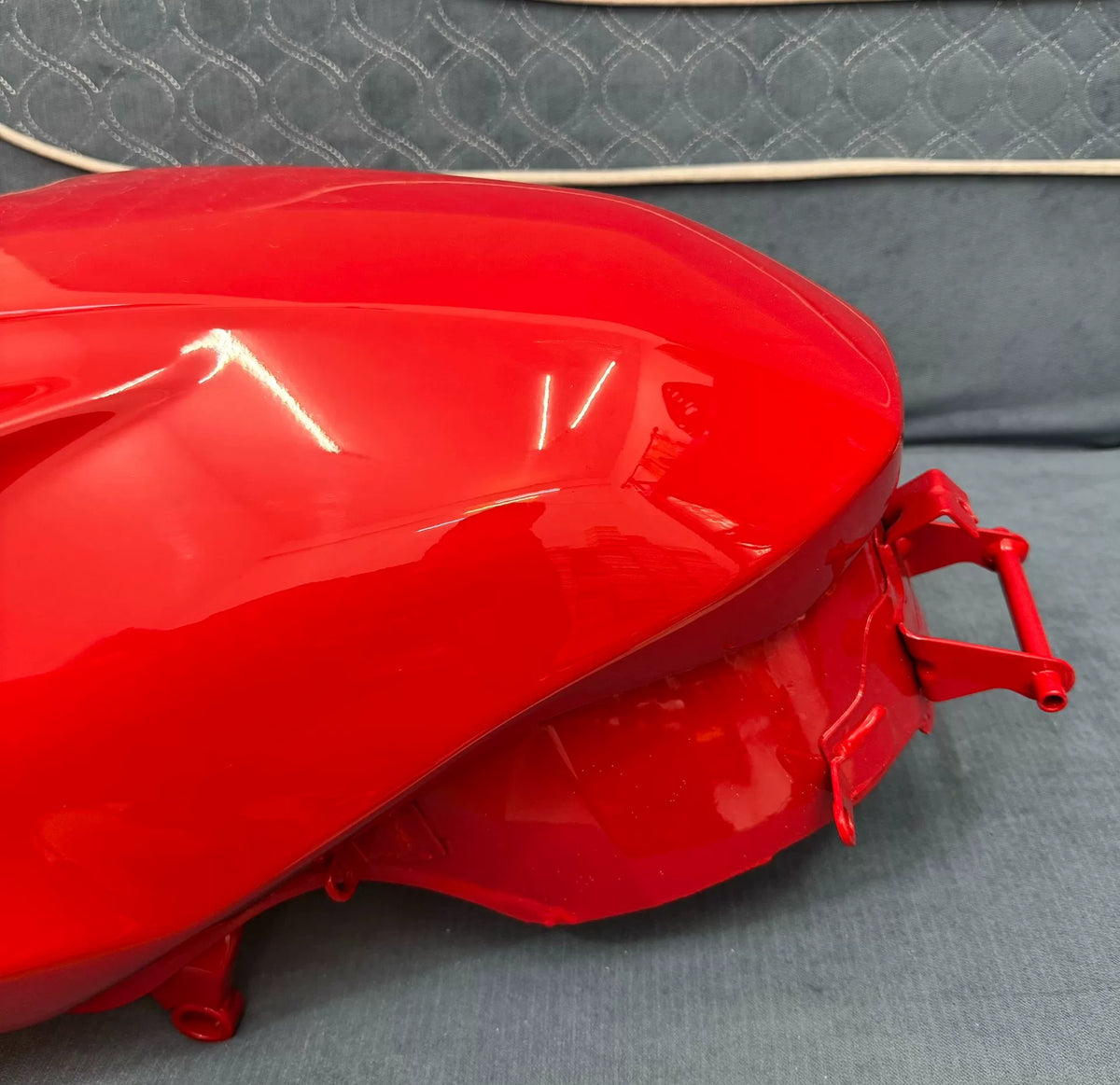 Diavel V4 gloss red fuel tank, rear angle detail showing mounting points and tail section fitment