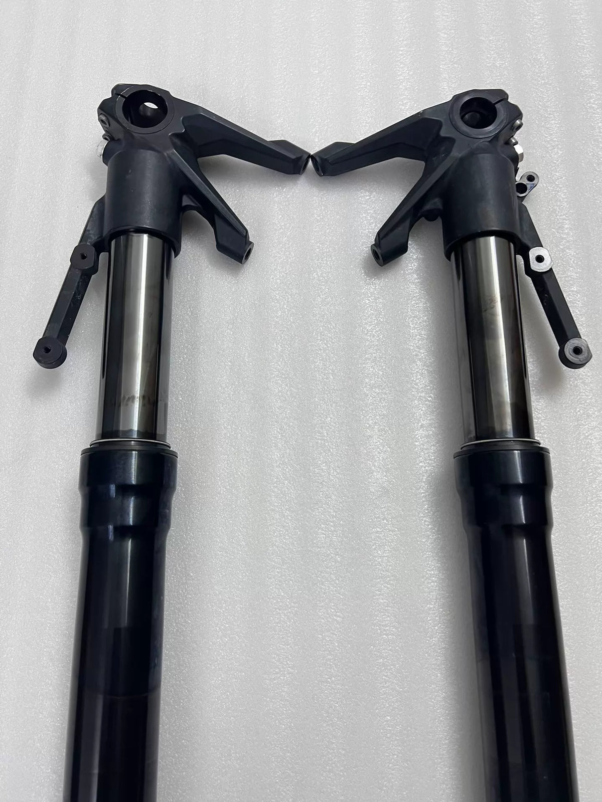 Ducati Diavel 1200 front fork lower leg detail, angled view showing axle clamp and caliper mount