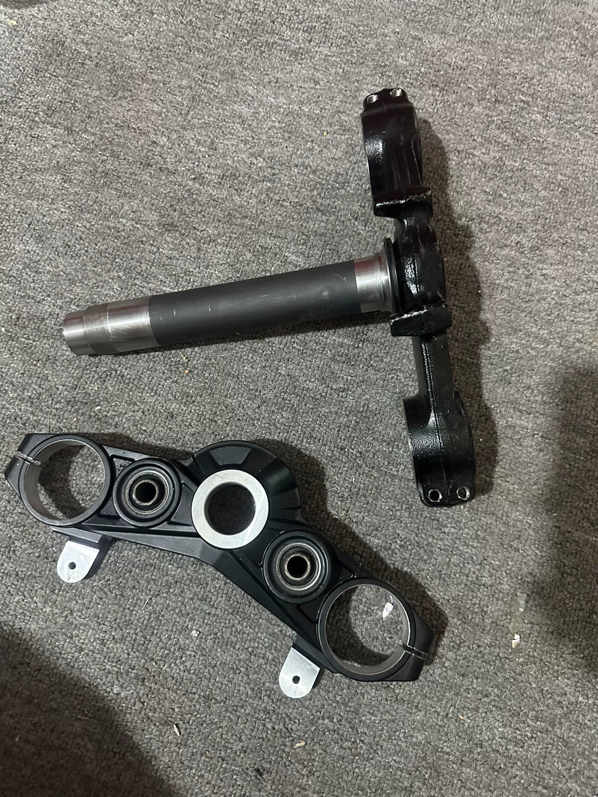 Kawasaki Z900 triple clamp close-up detail of fork tube clamp holes and fastener bores