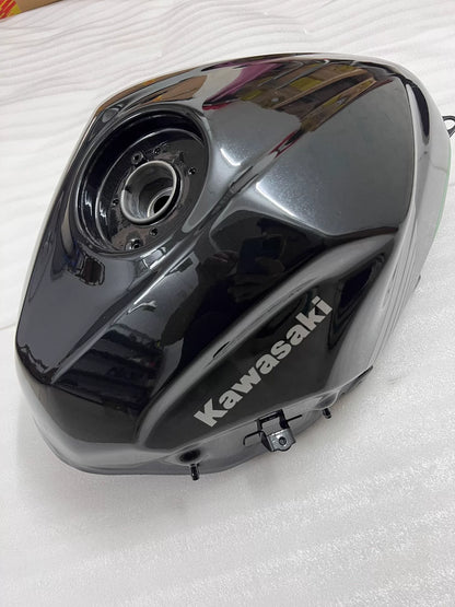 Kawasaki Ninja 400 fuel tank left side view showing tank shape and lower mounting tab detail