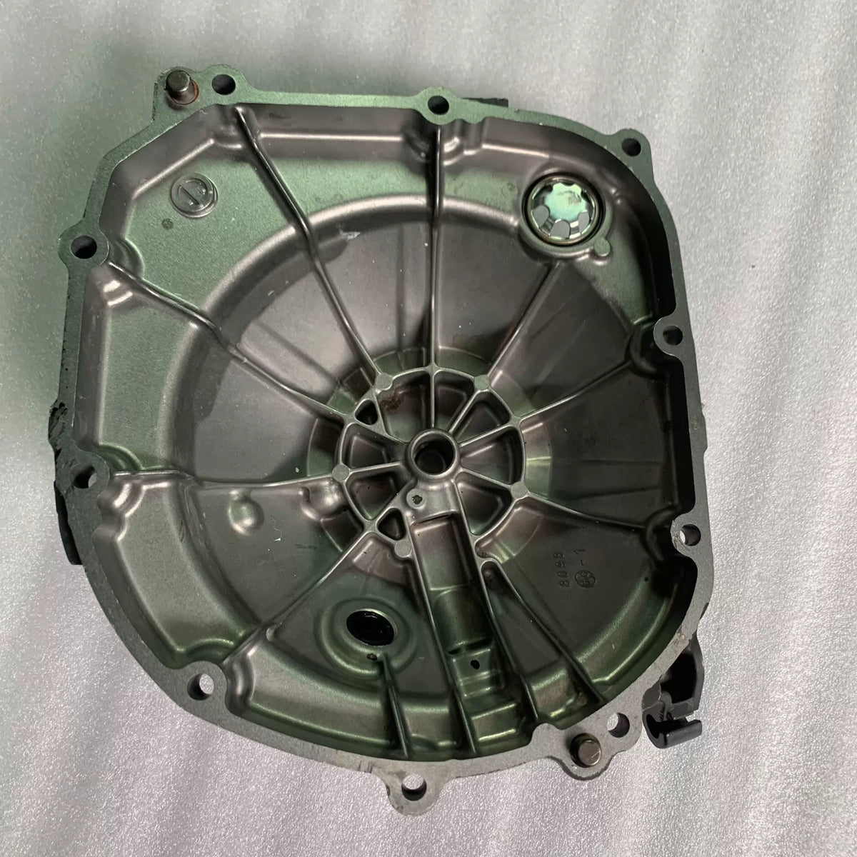 Inner side of clutch cover for Kawasaki ZR900 Z900, showing cast webbing, bearing bore and gasket surface
